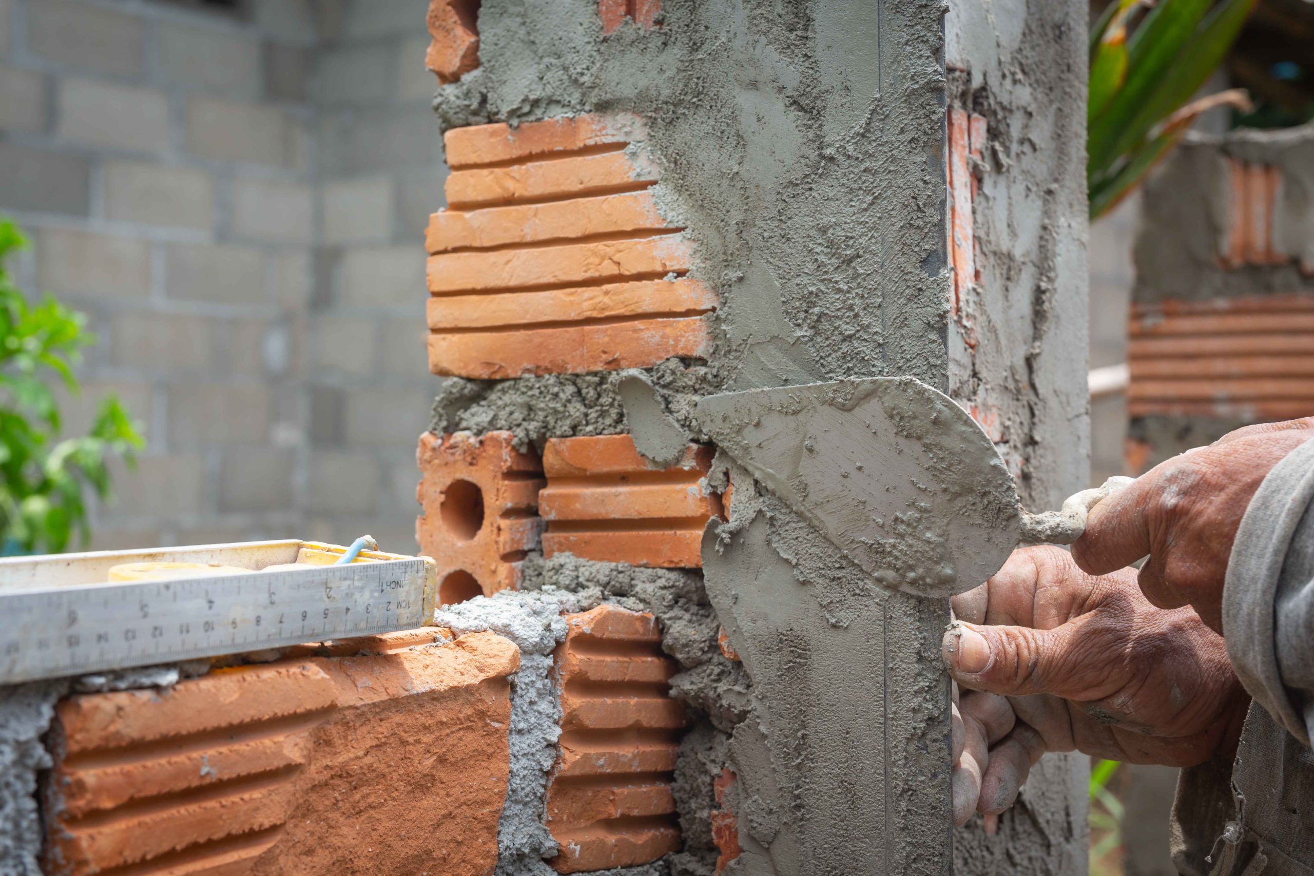 bricklaying-construction-worker-building-brick-wall_11zon (1)